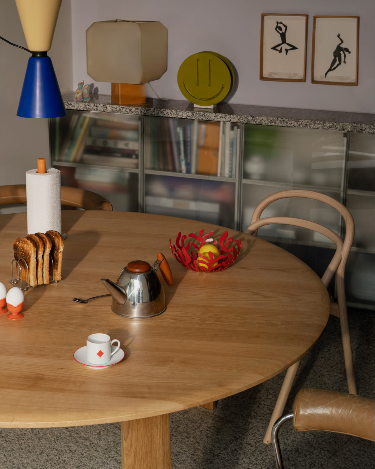 Hem - A lifestyle image of a dining scene featuring Alphabeta Pendant Light, Alle Round Dining Table, and Udon Upholstered Chair.