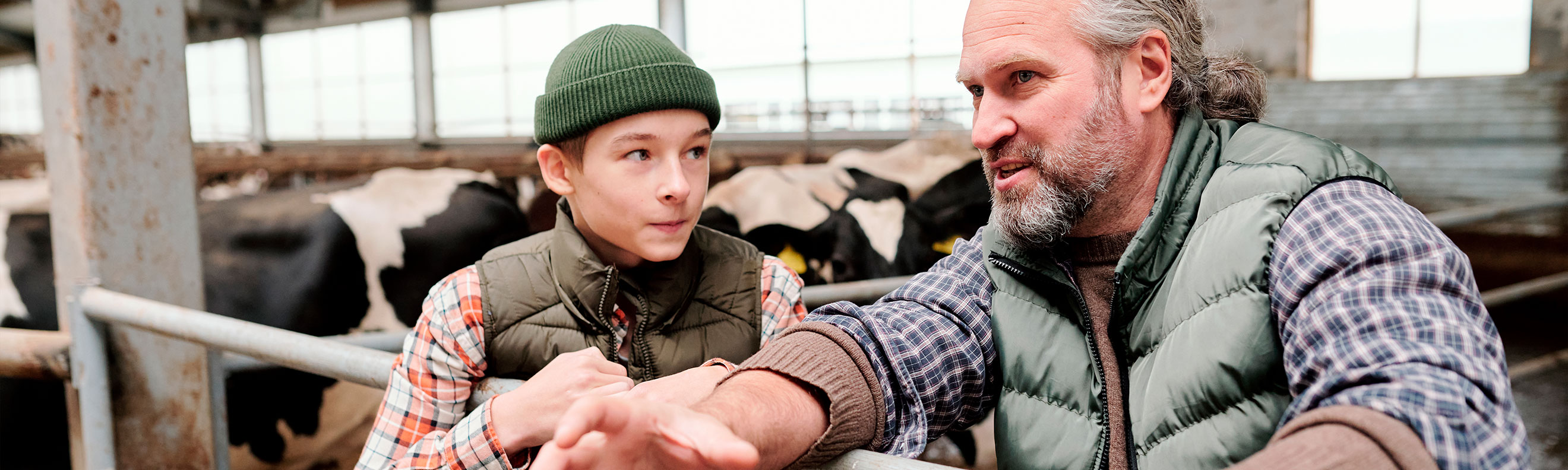 Father and son speak eachother in the stables 