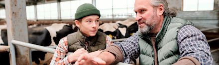 Father and son speak eachother in the stables