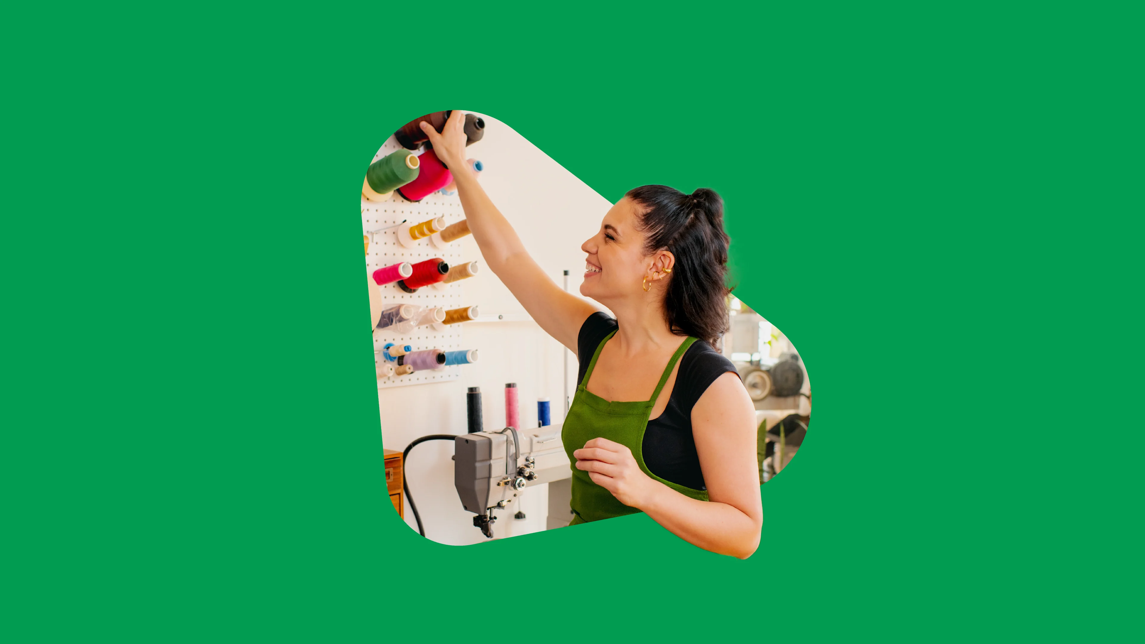 Woman grabbing yarn in a studio