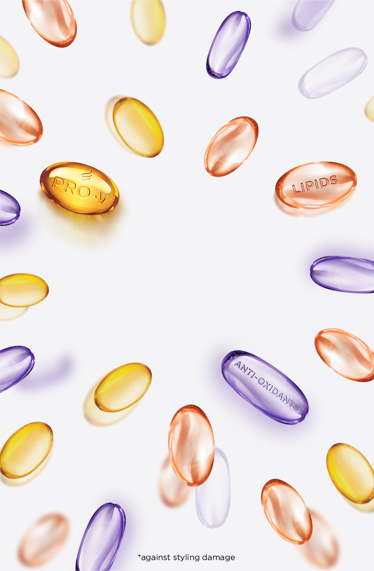 Round tablets in pink, purple and golden colour, illustrating the ingredients in Pantene Superfood
