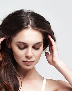 Woman holding her hair looking for solution