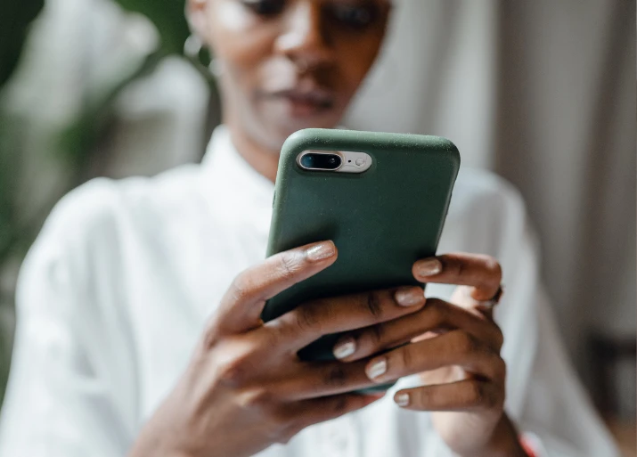 Image of a woman looking at her phone