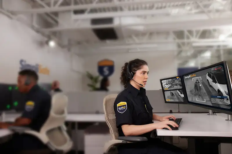 A professional monitoring agent looking at a monitor