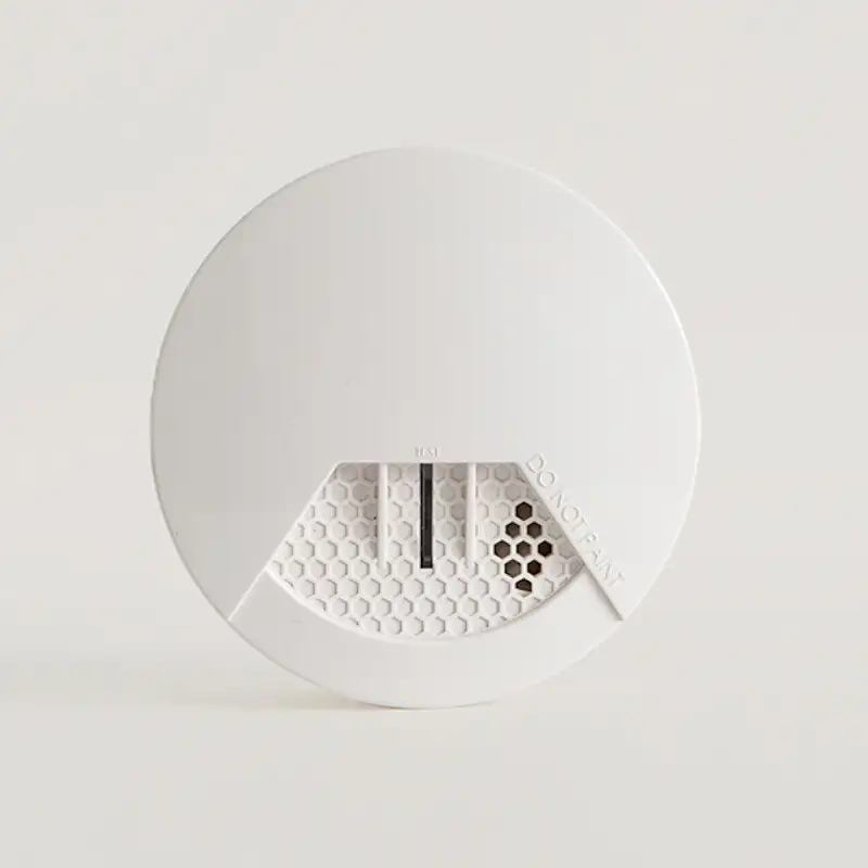Image of a smoke detector on a solid white background