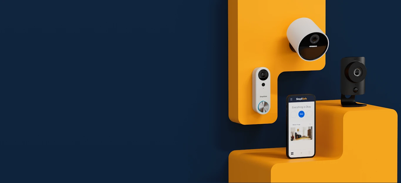 Simplisafe doorbell, outdoor camera, and cellphone with the Simplisafe App opened up