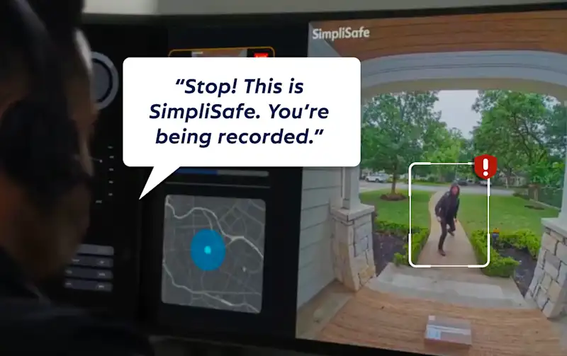 SimpliSafe® live monitoring agent viewing a Video Doorbell Series 2 feed of an intruder on the walkway, speaking through the camera: 'Stop! This is SimpliSafe. You're being recorded.