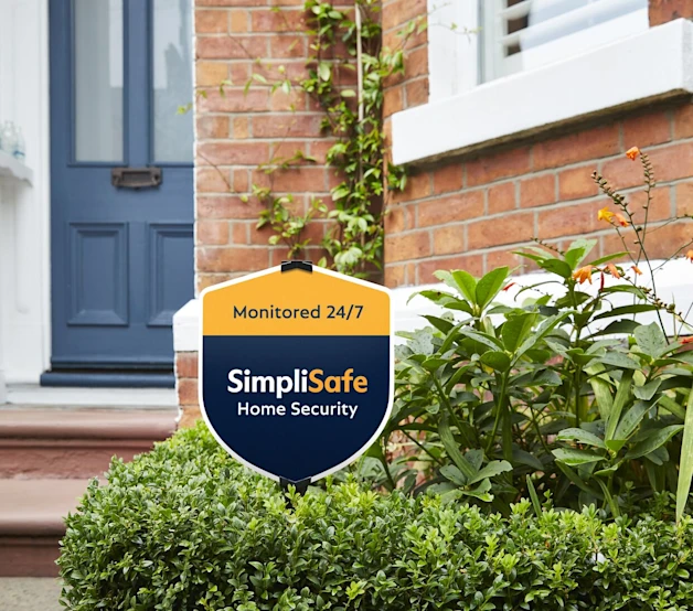 Image of Simplisafe yard sign on the front yard of a home