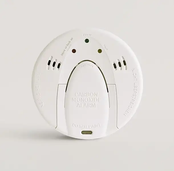 Image of a carbon monoxide detector on a solid white background