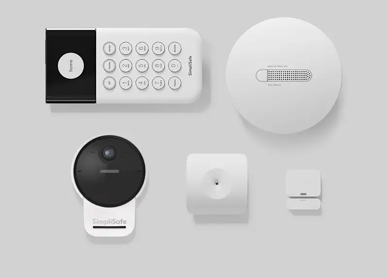 Image of home security sensors including a keypad, entry sensor, glassbreak sensor, smoke detector and outdoor camera
