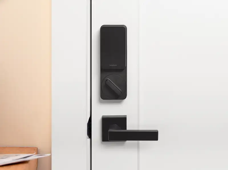 Image of a black smart lock mounted on a door