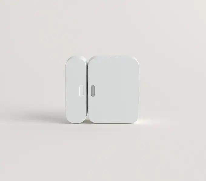 SimpliSafe Entry Sensor mounted on a white door frame. Heading reads: 'Entry Sensor.' Body text reads: 'Detect entry and trigger an alarm when doors or windows are opened.' Badge reads: 'Peel n' stick install.'