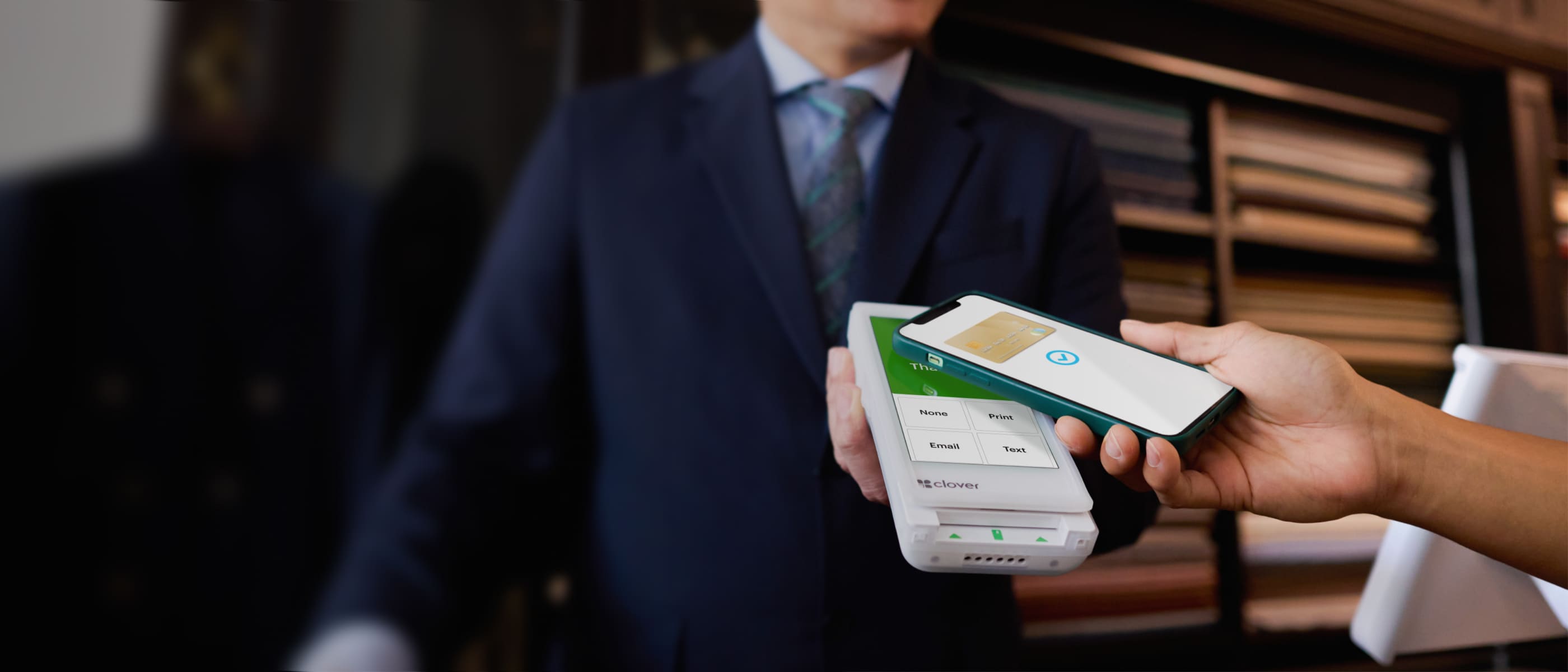 Tailor takes contactless payment on a Clover Flex. 