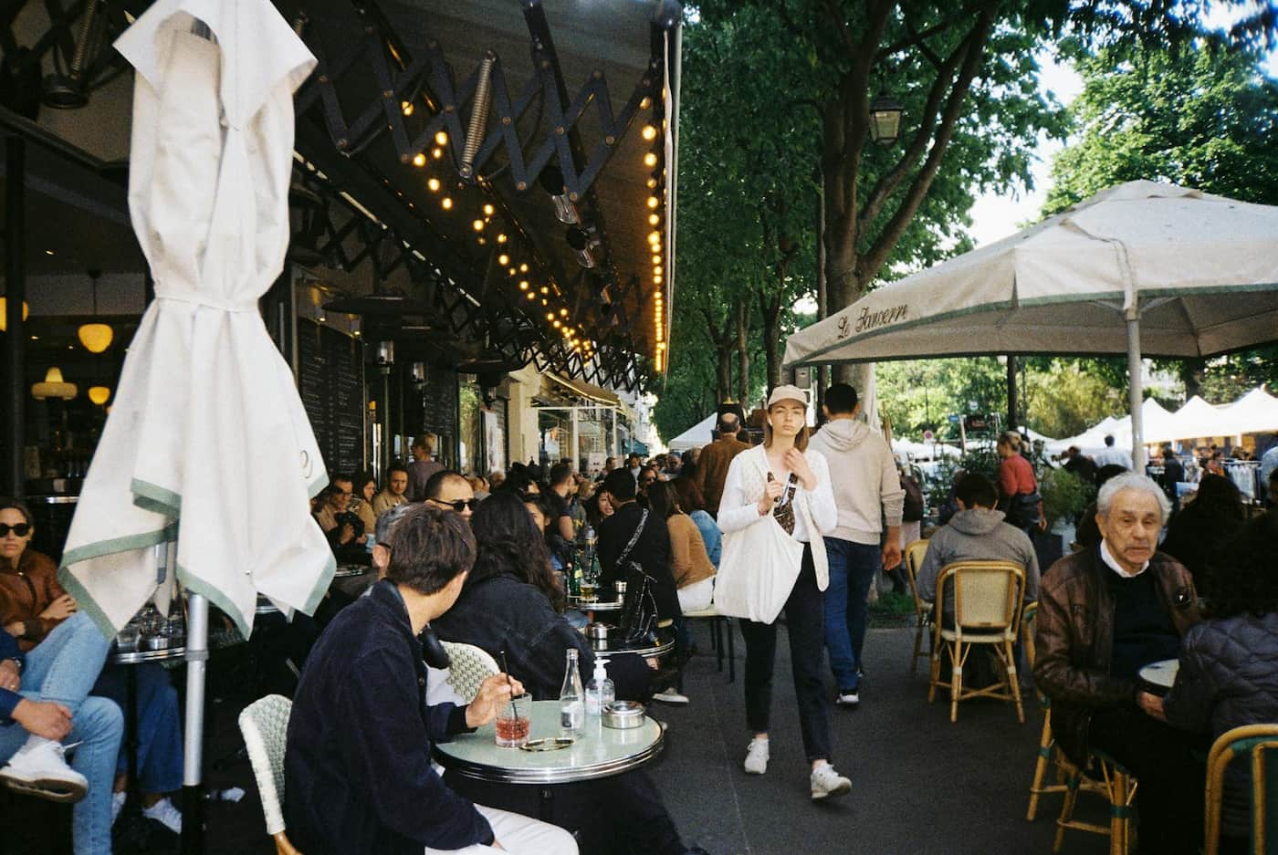 Busy cafe-with outdoor tables filled with customers