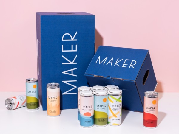 Two Maker Wine boxes with 10 assorted cans in front of them.