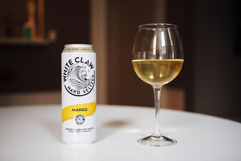 White Claw can and wine glass