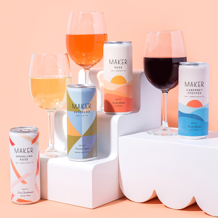 Four cans of Maker Wine sitting alongside three glasses of wine.