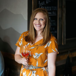Headshot of Colleen Clothier, Head Winemaker of Revolution Wines, with glass of wine in hand