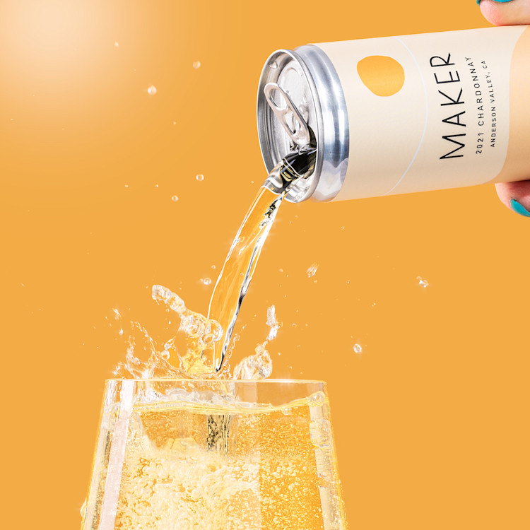 Can of Maker chardonnay pouring into a glass.