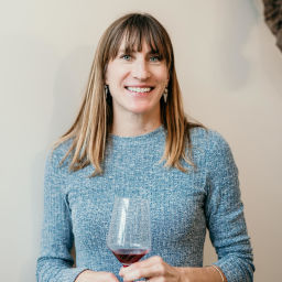 Nicole Walsh of Ser Winery with a glass of wine in hand
