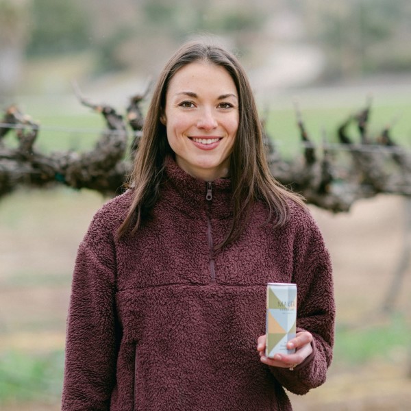 Emily Gokita photo in vineyard holding can