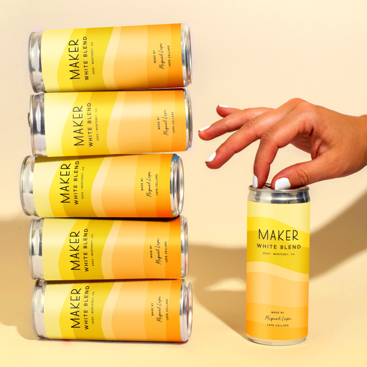 Spanish White Blend stacked cans with hand opening one can