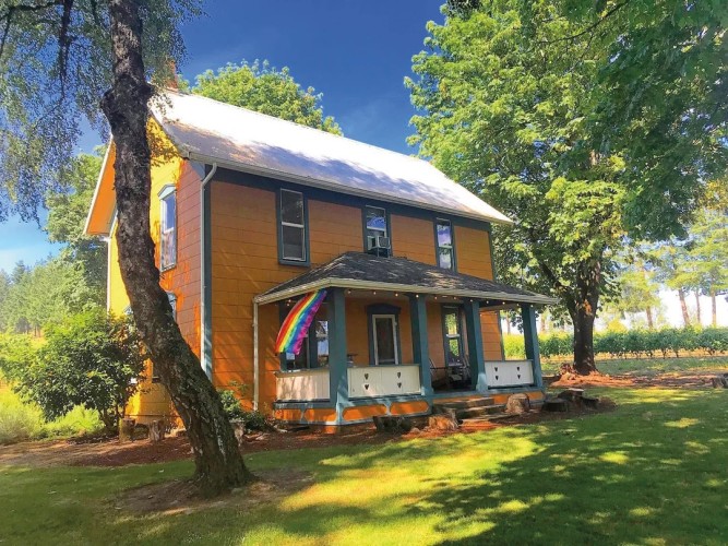 The house at Remy Wines Winery, featuring an LGBTQ+ flag flying from the deck.