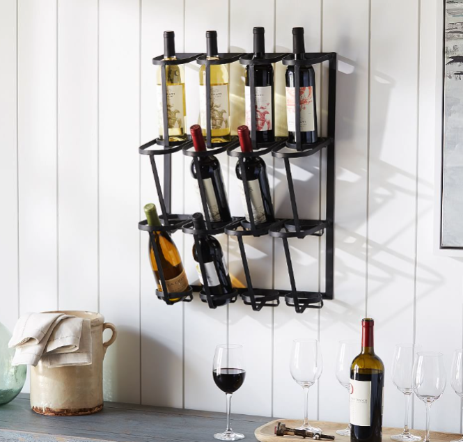 Wine bottle rack fixed to a wall with eight wine bottles and wine glasses