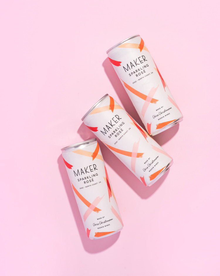 three cans of sparkling rose on a pink backdrop