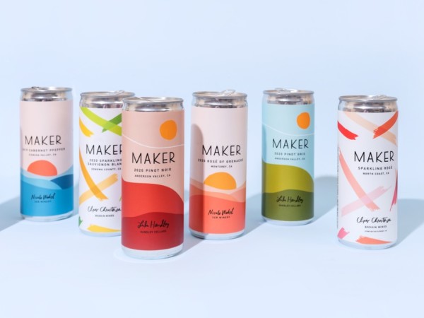 A staggered line of 6 Maker Wine cans.