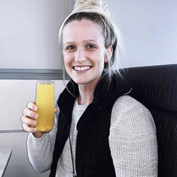 Cicely Walden, Fulfillment Manager at Maker, drinking a Mimosa