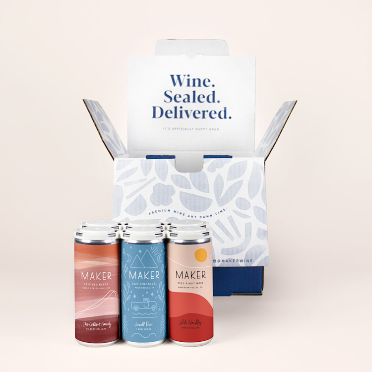 6 cans of red wine and an open blue shipping box