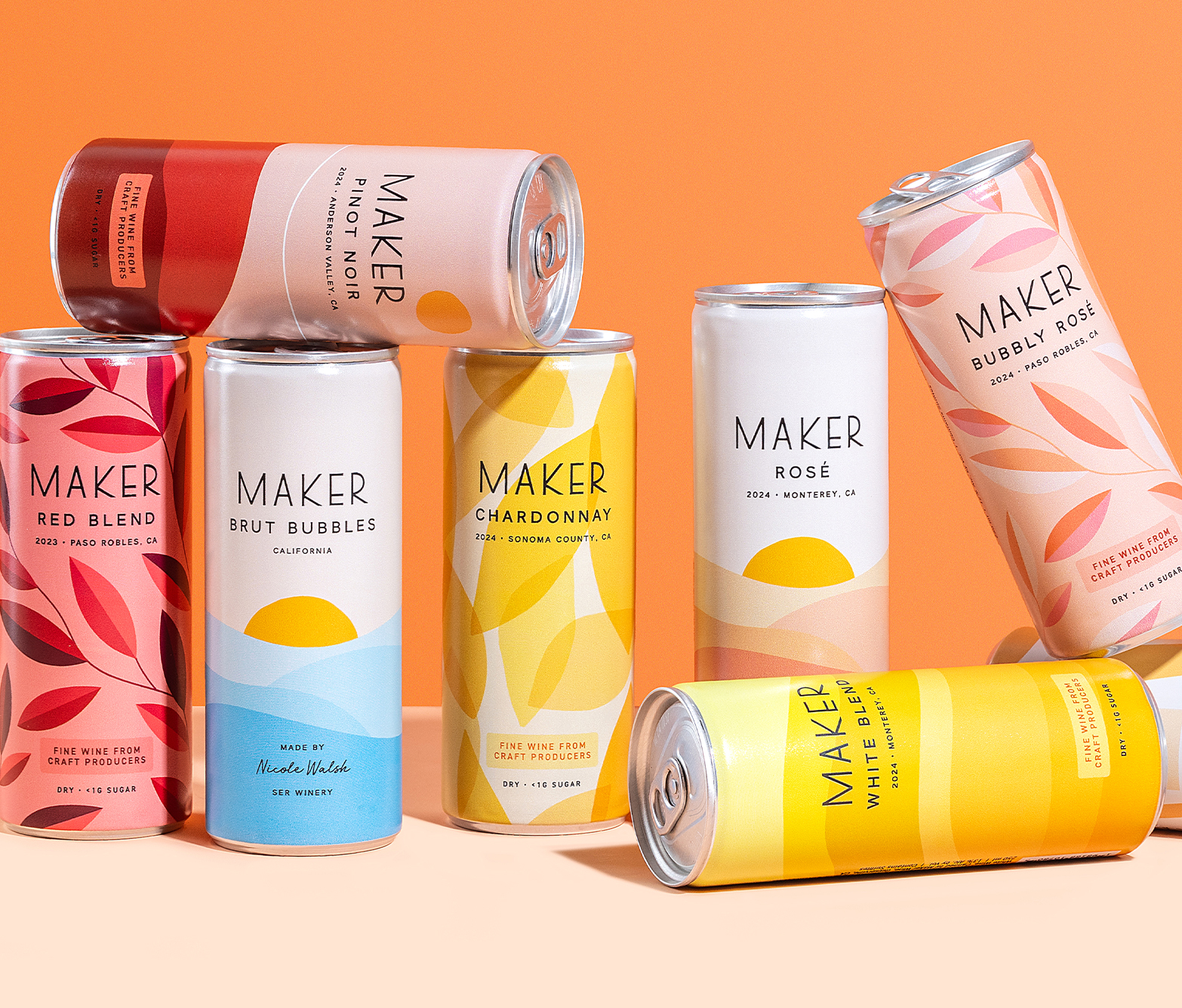 Maker Wine cans of different varietals organized against an orange background.
