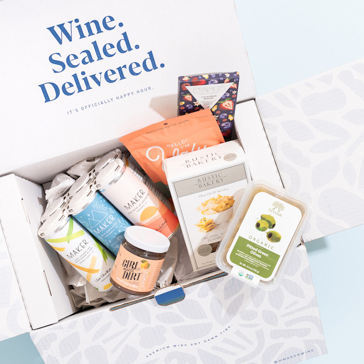 A photo of our gourmet snack box including locally sourced snacks and premium canned wine.