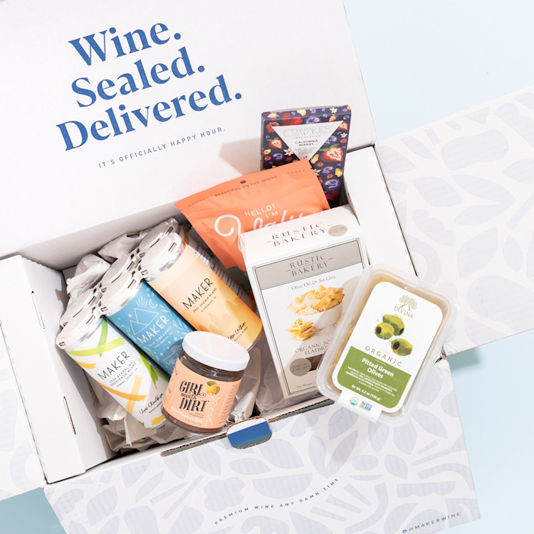 A photo of our gourmet snack box including locally sourced snacks and premium canned wine.