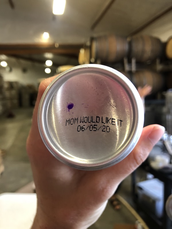 The bottom of a can that reads "Mom would like it, 06/05/20".