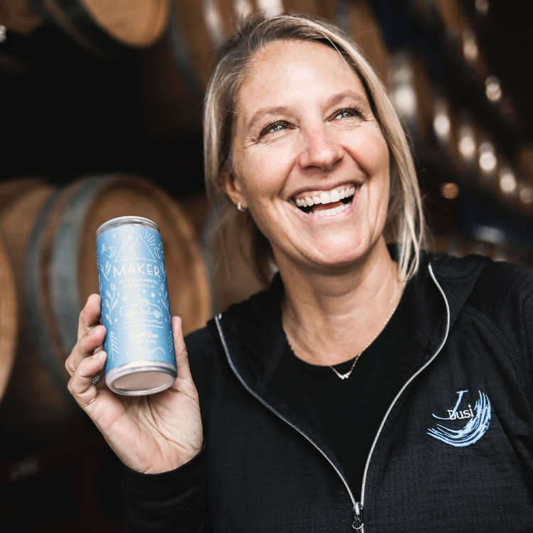 Janell Dusi holding a can of Zinfandel.