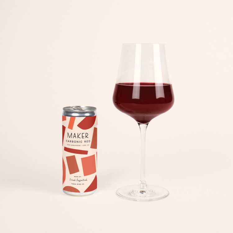can of maker carbonic sangiovese with glass of red wine