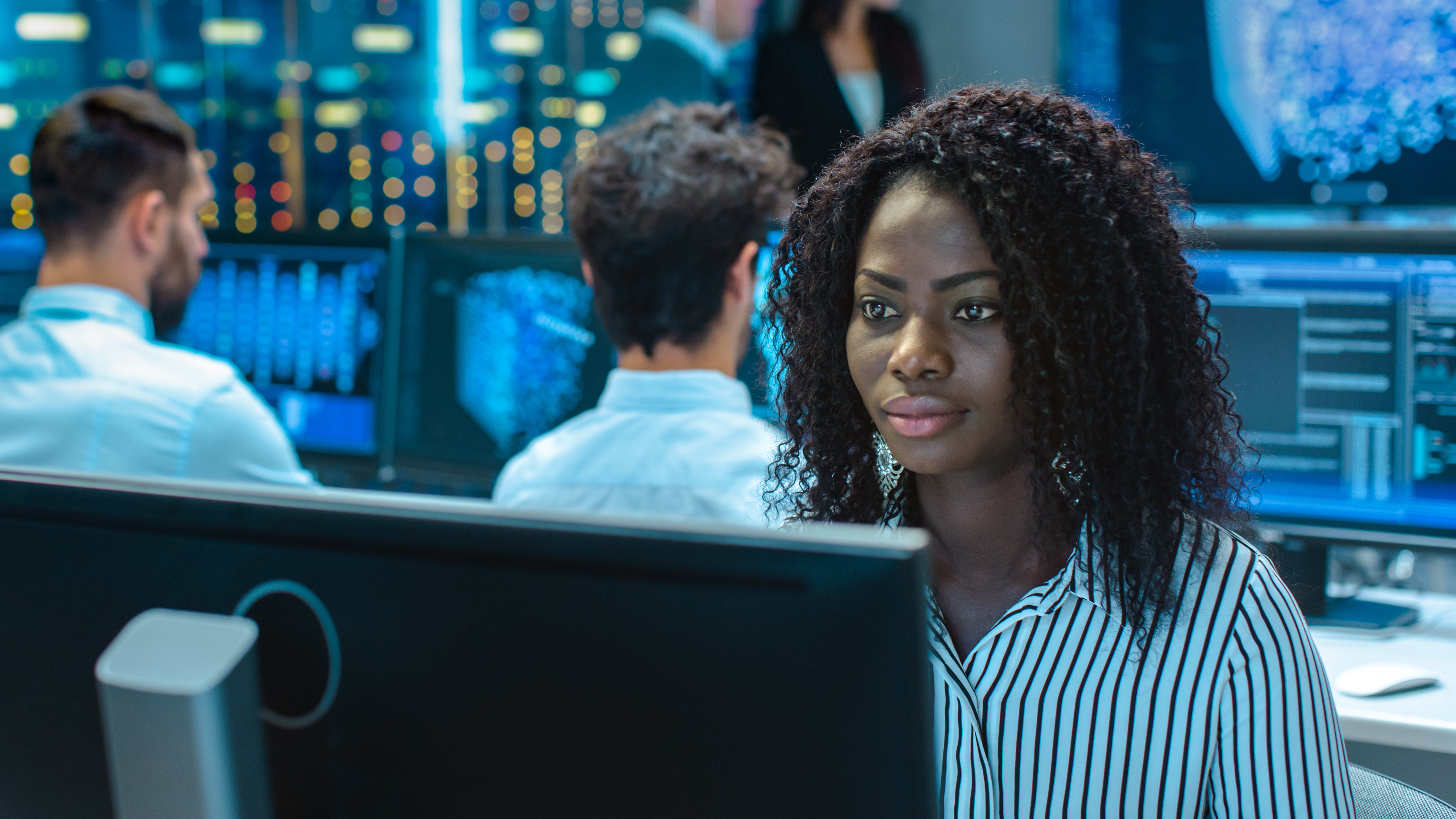 a woman working in a hi-tech office