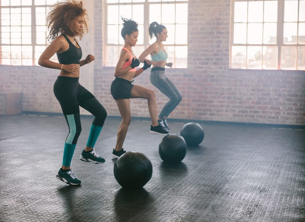 3 women working out with gym balls