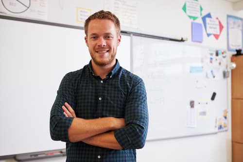 a teacher standing in a classroom