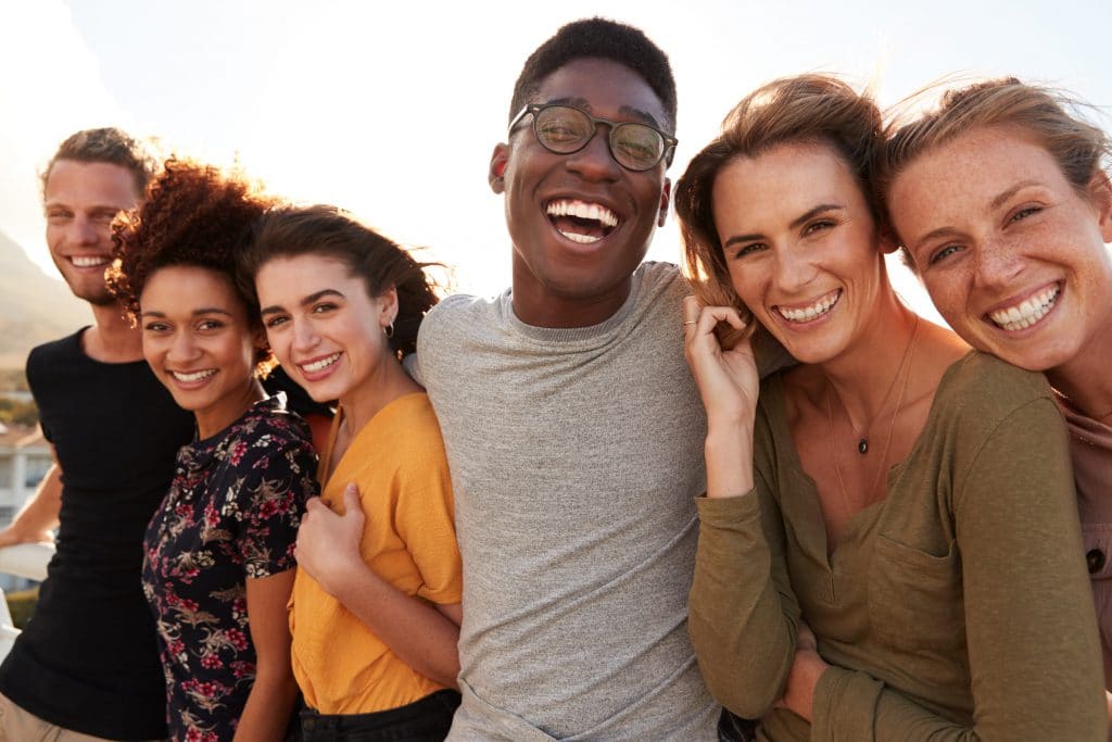 a group of 6 people smiling