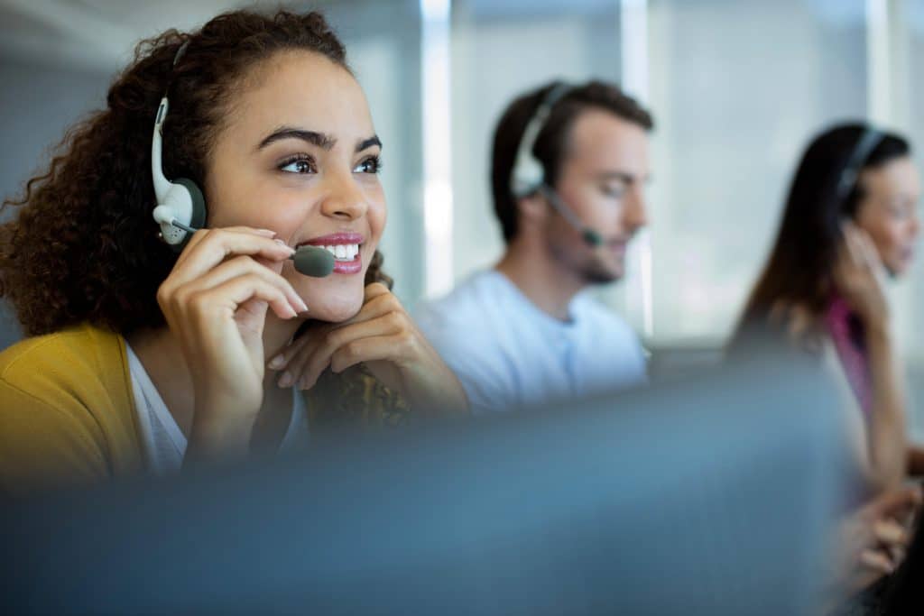 a call desk agent smiling