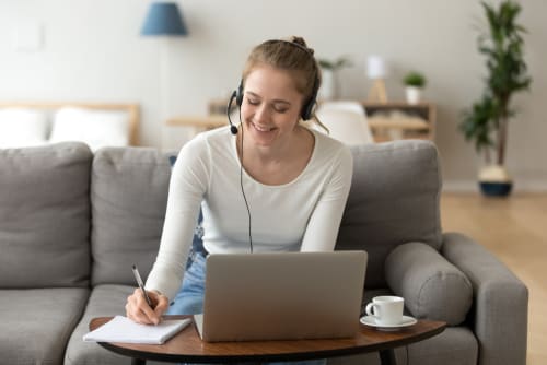 a woman working on a couch