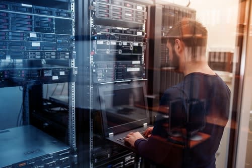 a man working at a server terminal