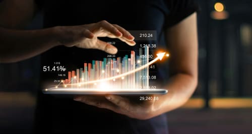 a man holding a tablet with a bar chart coming out of it