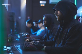 a group of people hacking on computers
