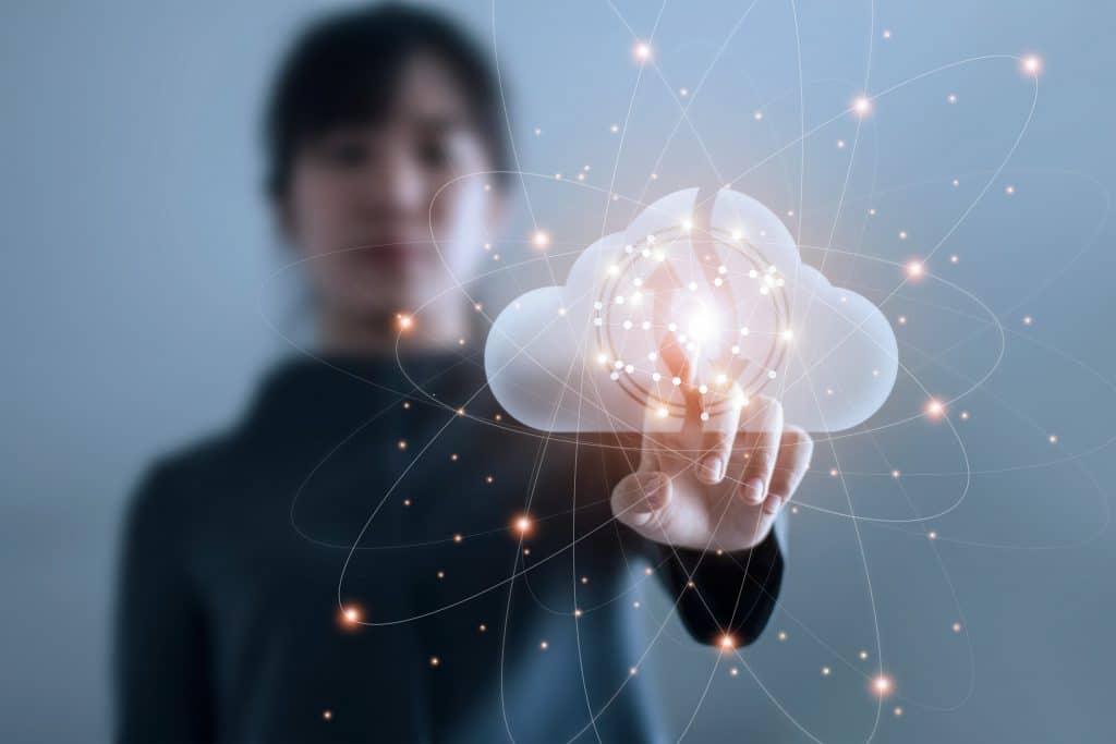 a woman touching a digital cloud
