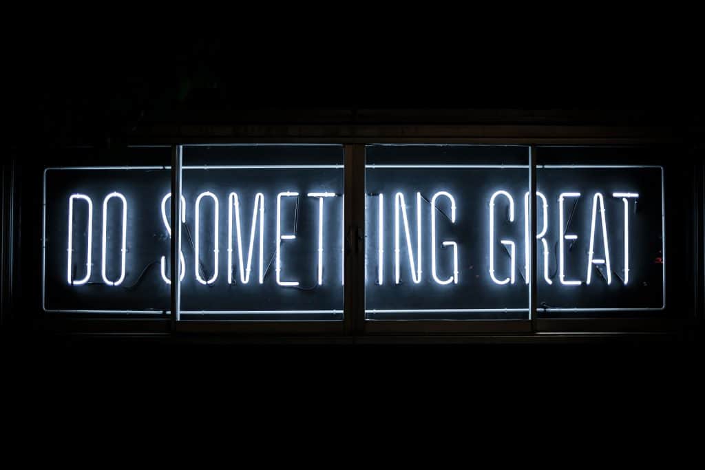 neon sign saying "Do something great"