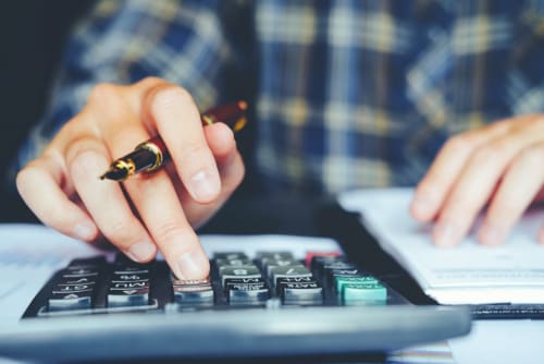 a man using a calculator